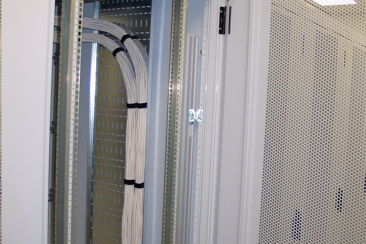 Wall-mounted equipment rack with structured cabling